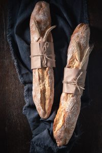 Homemade baguettes baked in bakery. Made of wheat and rye.